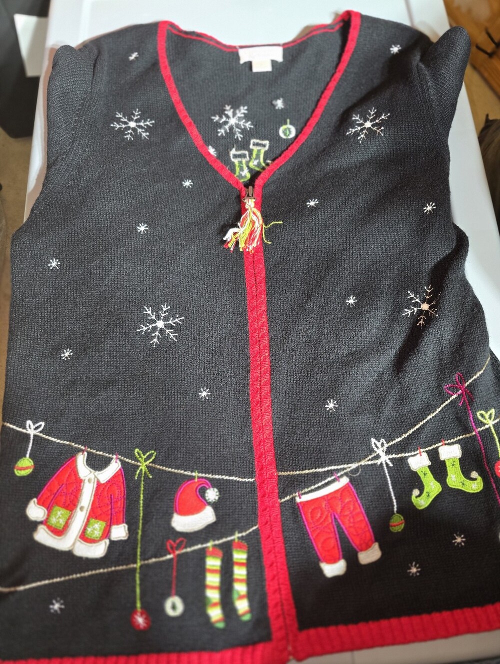 Black Holiday Cardigan with Red Trim and Festive Embroidered Laundry Line